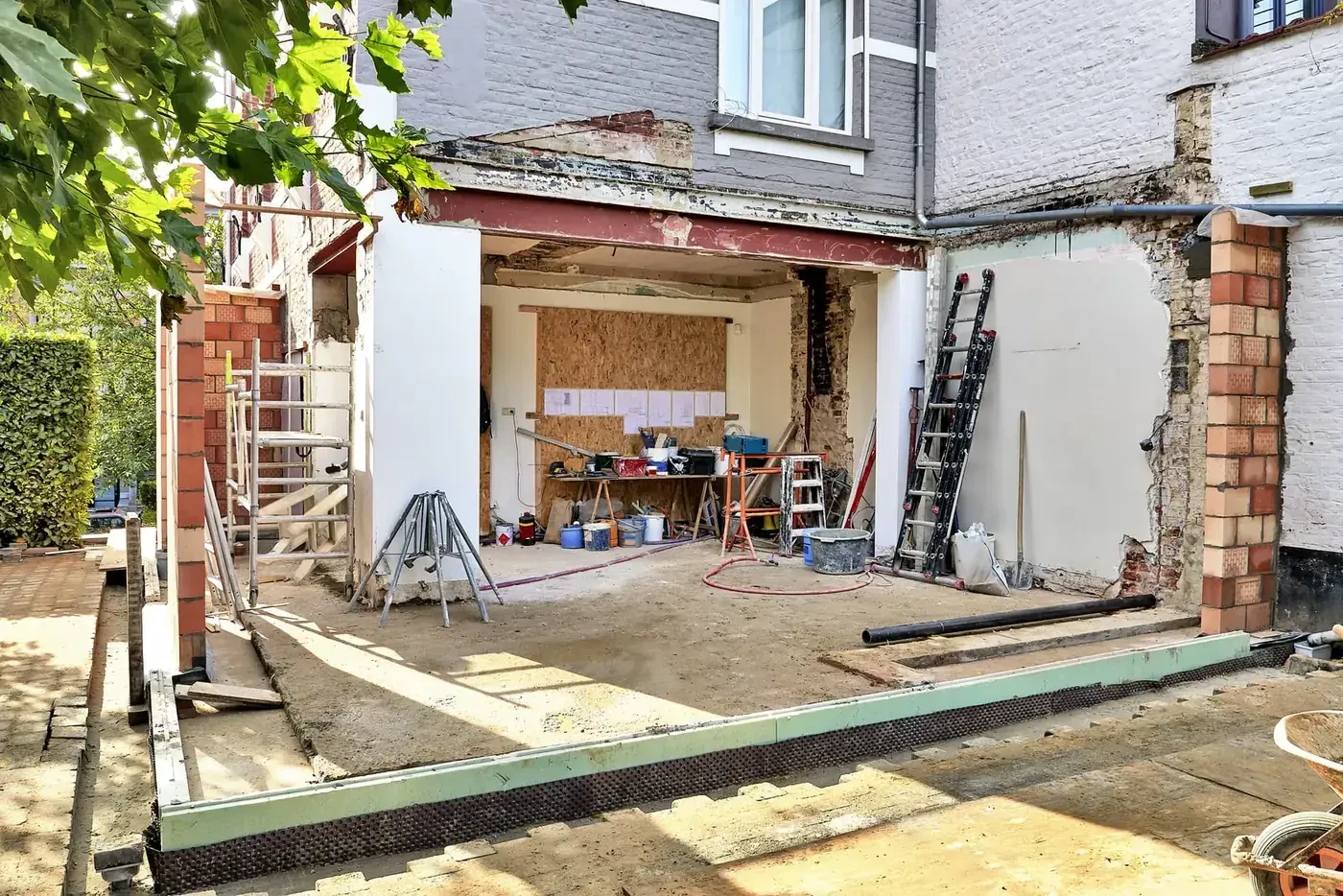 Specialist reviewing plans on a construction site. Illustrative photograph.
