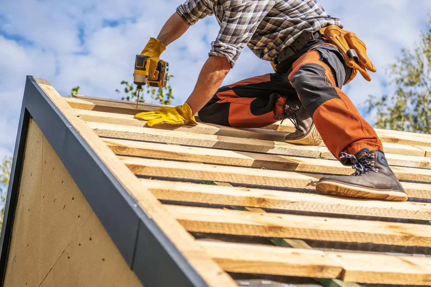 Roofer fixing timber battens. Illustrative photograph.